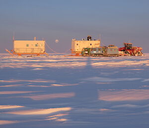 Traverse camp at dawn with setting moon