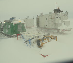machinery buried by snow in blizzard