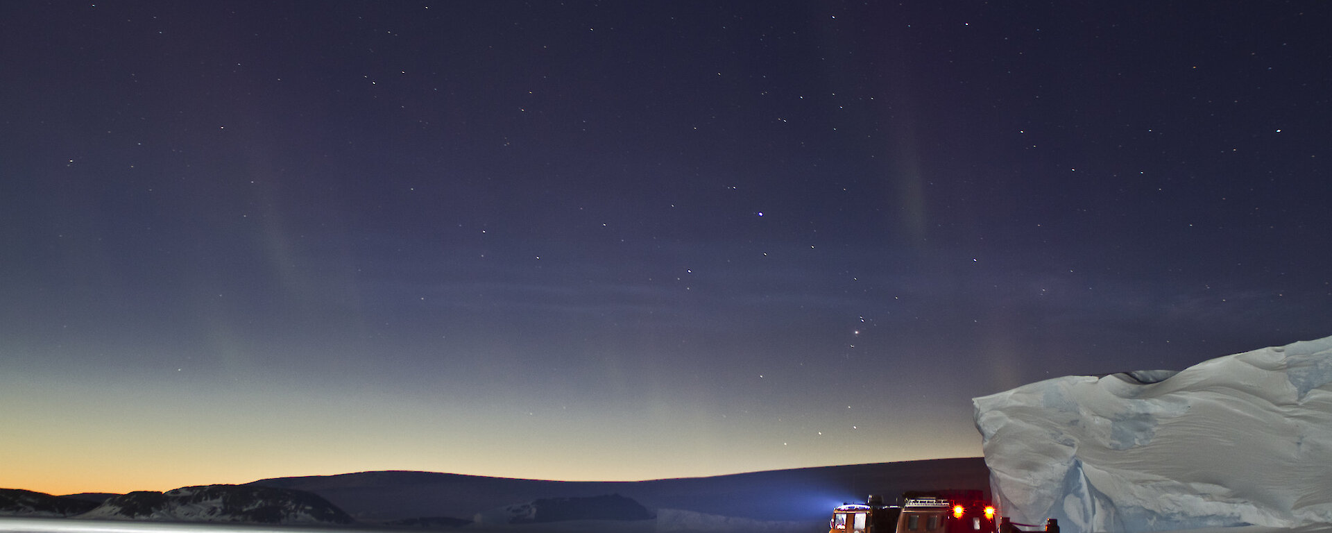 Hägglunds on fast ice at night.