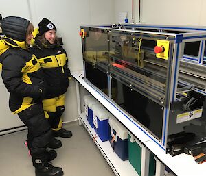 Two scientists in freezer with line scanner