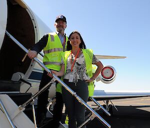 AAD Director and Operation IceBridge deputy project scientist stand on the stairs up to the plane