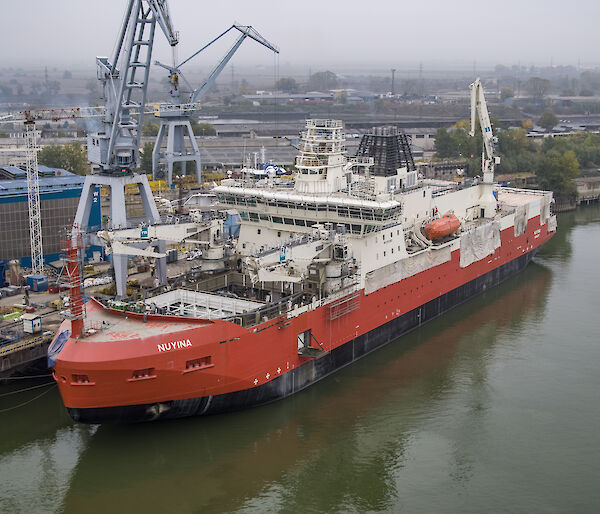 The Nuyina docked by a wharf in Romania.