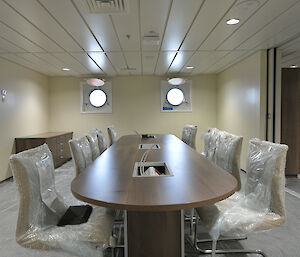 Table and chairs in the science meeting room.