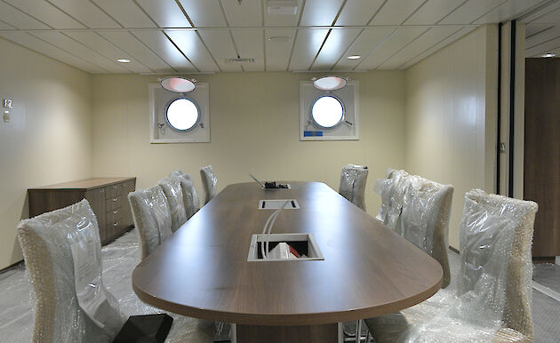 Table and chairs in the science meeting room.