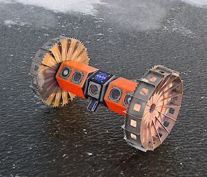 The Buoyant Rover for Under-Ice Exploration (BRUIE) sitting on the ice