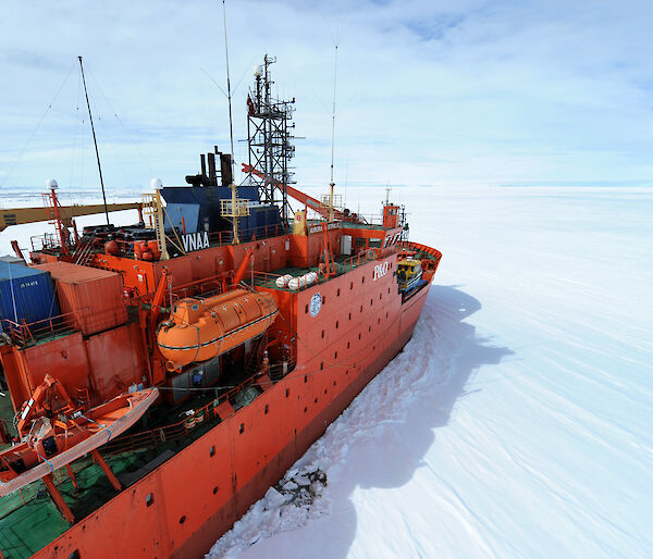 Aerial view starboard side Aurora Australis parked at the edge of the fast ice