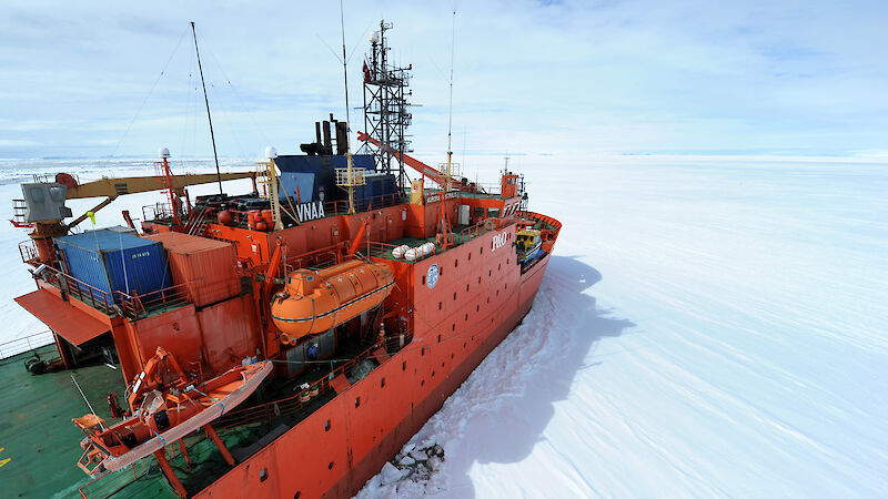 Aerial view starboard side Aurora Australis parked at the edge of the fast ice
