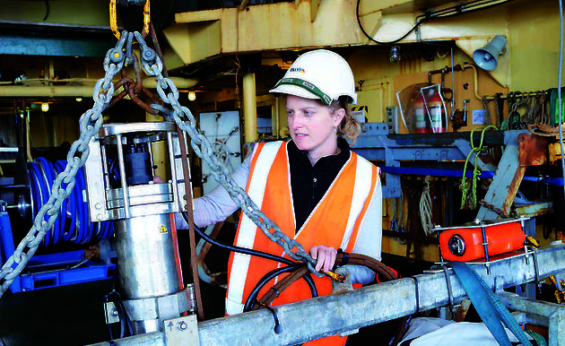 Expeditioner checks underwater camera on the trawl deck of the RSV Aurora Australis