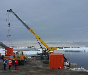 Container being unloaded at Casey wharf by Crane