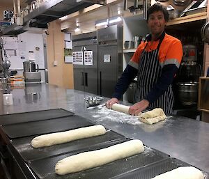 Sean standing in the kitchen making bread