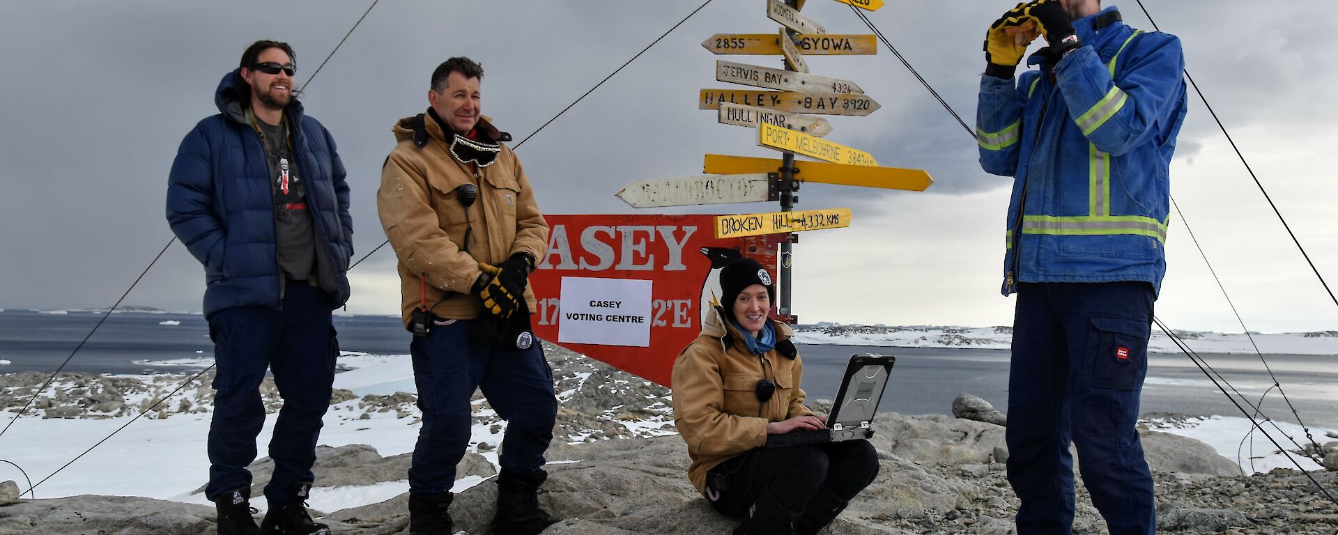 Brendan standing at the Casey sign with Sean, Pete and Amy after voting