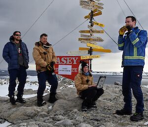 Brendan standing at the Casey sign with Sean, Pete and Amy after voting