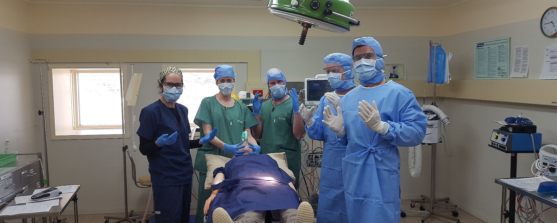 Bemused team asked to hold hands up “like doctors” in the operating theatre. Marissa, Amy, Garvan, Rhys and Aaron
