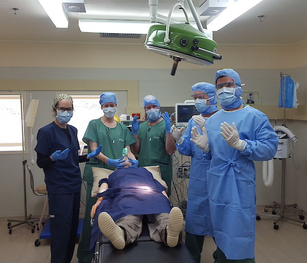 Bemused team asked to hold hands up “like doctors” in the operating theatre. Marissa, Amy, Garvan, Rhys and Aaron