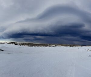 A wind storm brews in the distance before bringing a blizzard to Station