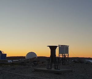 Sunrise with the Automatic weather station at Casey in the foreground