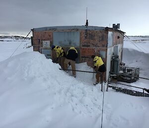 Digging snow away from the door of Wilkes Hilton after a blizzard