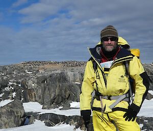 Craig standing in the foreground with penguin in background at Shirley Island