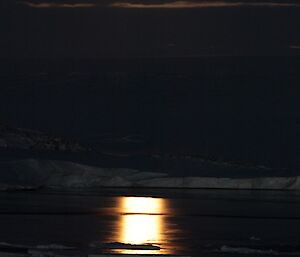 Moonrise over the water and snow Newcomb Bat