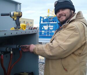 Leigh working on an electrical cabinet