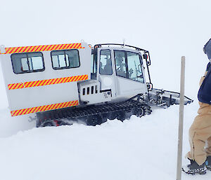 Tropper clearing snow with person in foreground