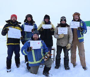 Five members of the team holding up Happy Mother’s Day signs (Juan, Aaron, Franko, Alan, Rex and Gavin)