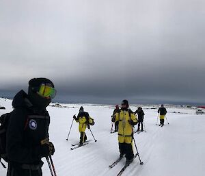 A group of skiers heading to Wilkes with Casey in the background