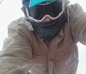 David standing knee deep in snow on his way to the Tank House