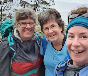 Scott King’s Mum, Aunty and sister on a hike with trees in the background