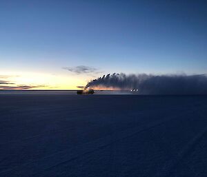 Snow blower clearing the runway at Wilkins at sunrise