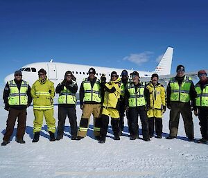 The wilkins team with Dr Karl and Kim Ellis the new director standing in front of the Airbus on the ice runway
