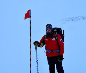 Matt next to flag marking drill location