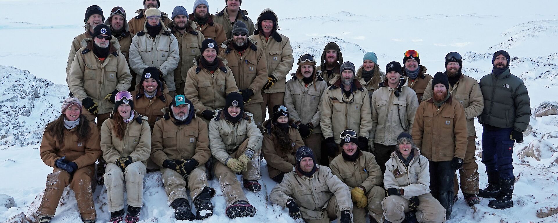 The 29 members of Casey on top of Reeve Hil with a snowy backgroundl