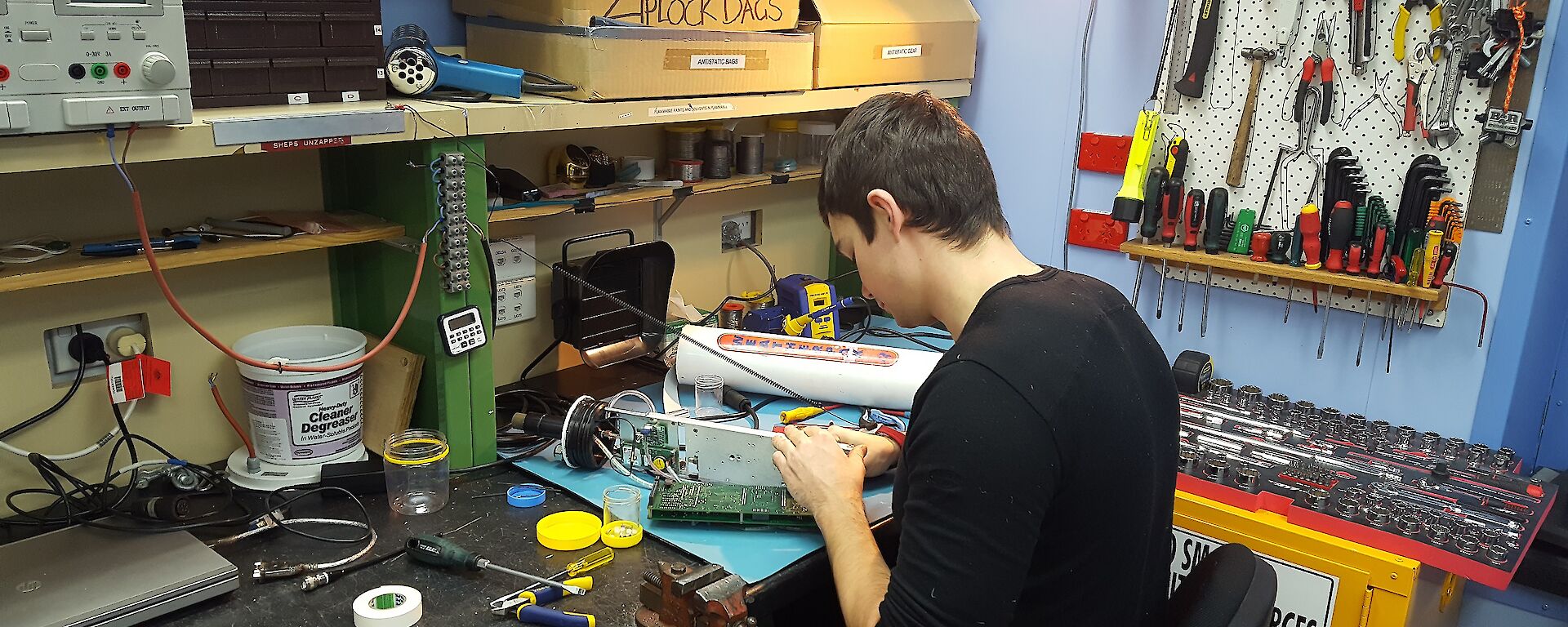 Sam sitting at his workbench