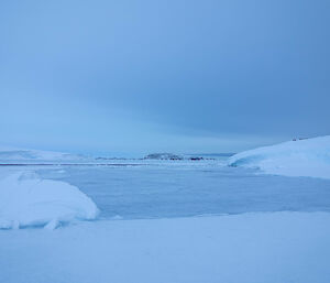 Carve out of the ice showing water along the cliff face