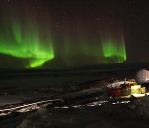 A green sheet across the sky over the ANARESAT building at Casey