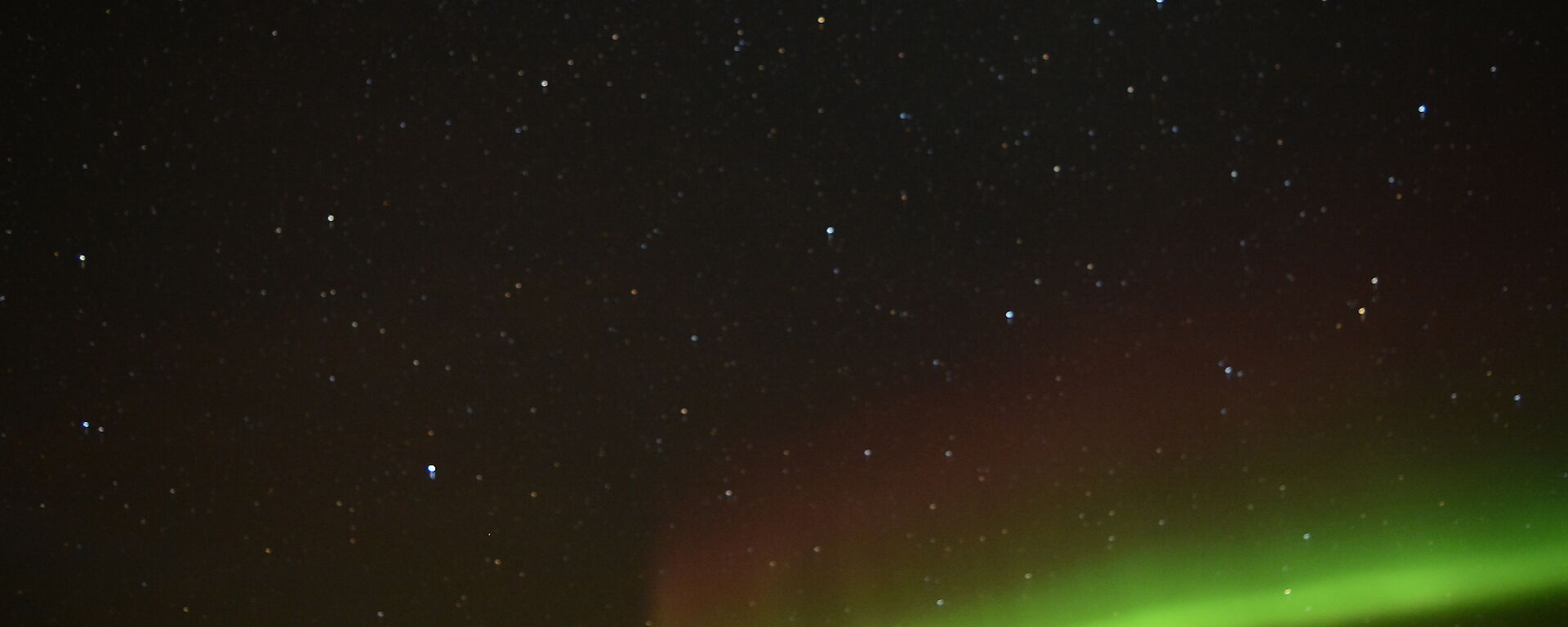 A bright green with light shades of red in the aurora taken the night of the refuelling