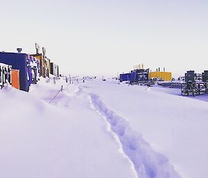 A path through the new snow shown and the building of Casey on the left and right