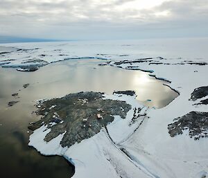 A drone view of the wharf, across the bay to Wilkes with icebergs in the distance