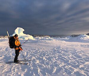 Al on skis with his travel pack with snow and ice all around