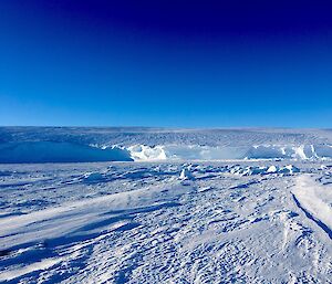 White of the sea ice and ice cliffs against the deep blue sky