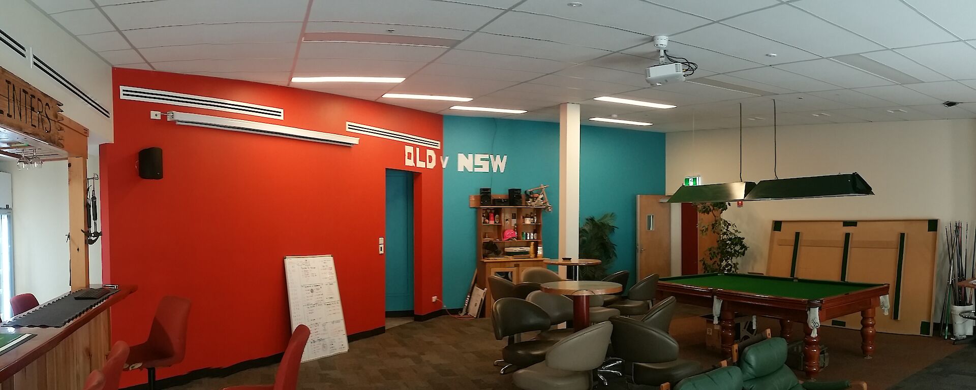 The completed bar with red and blue walls and the new bar area