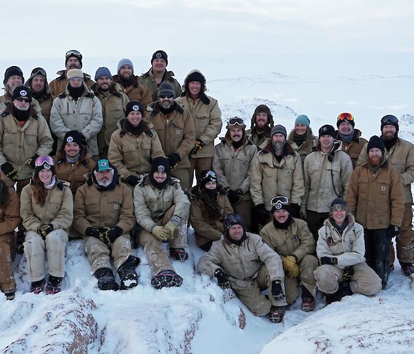 The 29 members of Casey winter team standing on snow covered Reeve’s Hill