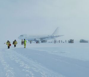 The A319 on the ice at Wilkins Aerodrome with fog starting to roll in as the first expeditioners for this season
