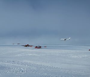 The A319 landing at Wilkins Aerodrome with two Baslers on the apron