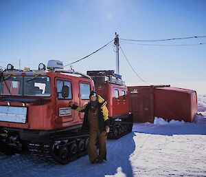 Natasha Behrendorff leaning on the side of a red Hagg parked in front of the medical tent at Wilkins