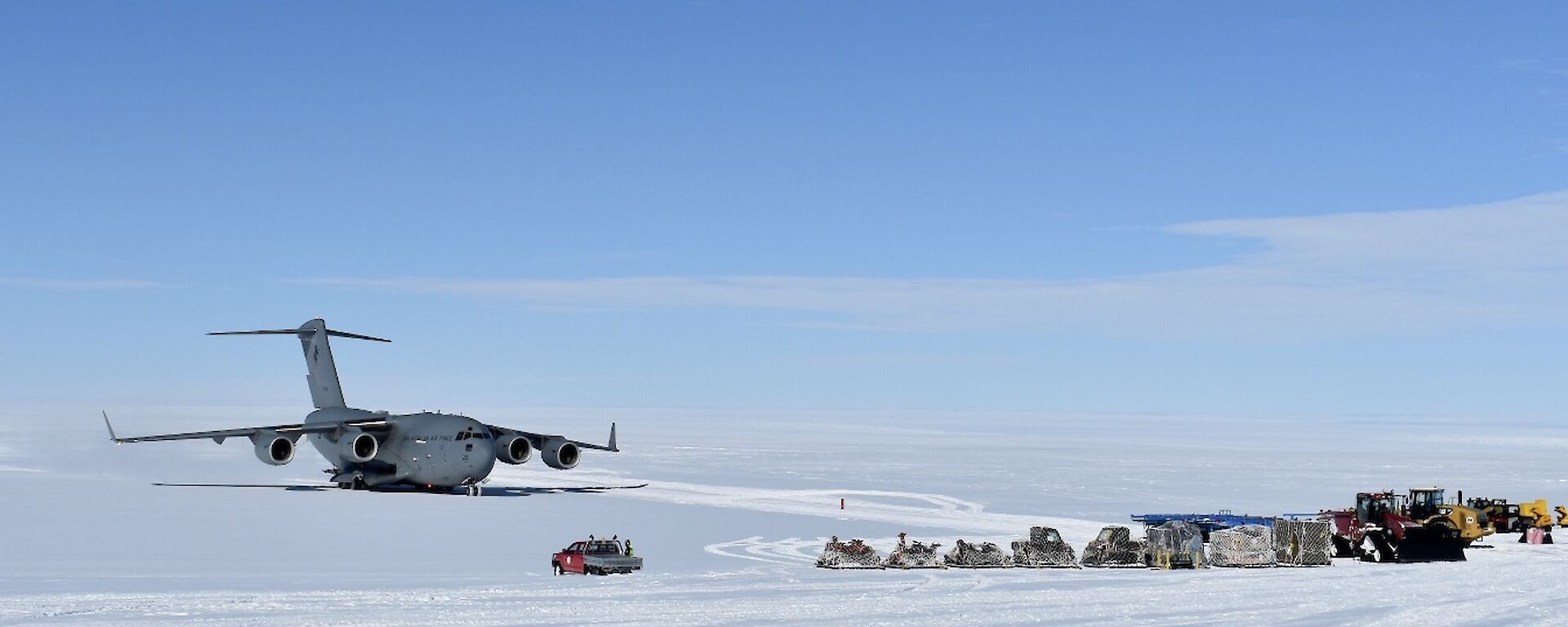The C17 on the apron at Wilkins Aerodrome dwarfs the vehicles awaiting cargo and passengers