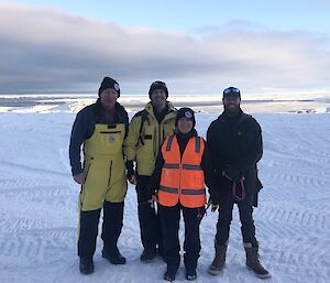 ADF representatives Marcus Bailey and Dion Wright outside Casey station with station leader Ali Dean and ops coordinator Nick Watt