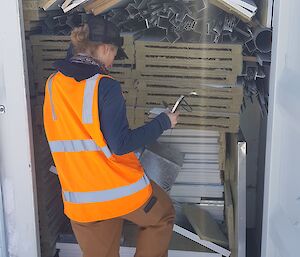 Lauren Wise inspecting the contents of containers at Casey