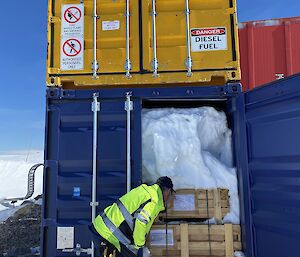 Mick Clarke inspecting the contents of a container at Casey